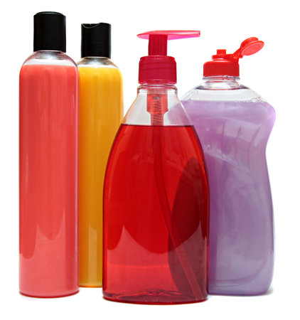 four colored plastic bottles with liquid soap and shower gelの写真素材