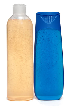 colored plastic bottles with liquid soap and shower gelの写真素材
