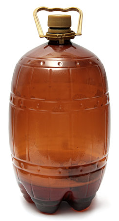 Large Plastic brown bottle of beer isolated on white の写真素材
