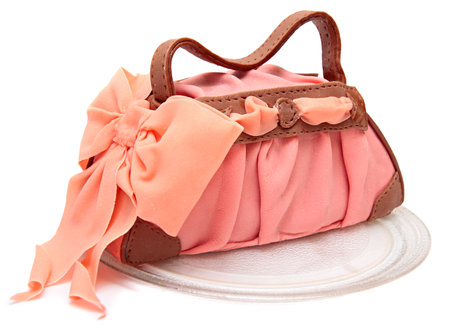 cake in the form of a female bags. cake with mastic and marzipan isolated on a white .の写真素材