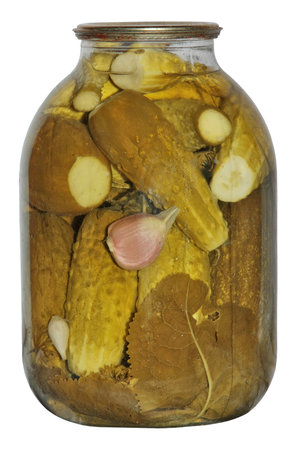 canned vegetables . Pickles in a glass jar isolated on a white .の写真素材