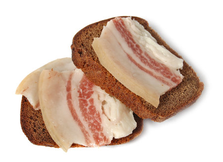 salted pork fat and Borodinsky rye bread isolated on a white backgroundの写真素材
