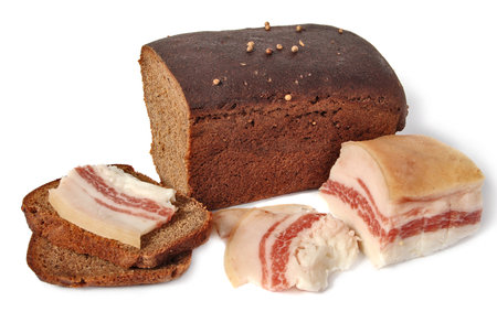 salted pork fat and Borodinsky rye bread isolated on a white backgroundの写真素材