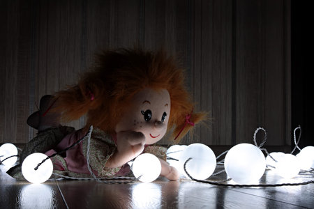 Doll reads a letter. Doll lying on the floor among the lanterns. Russiaのeditorial素材