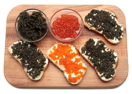 Black and red caviar in a glass containerの写真素材