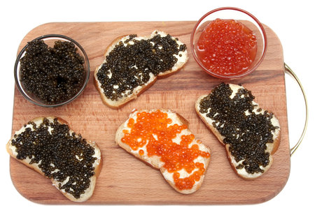 Black and red caviar in a glass containerの写真素材