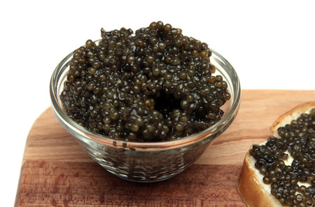 Black and red caviar in a glass containerの写真素材