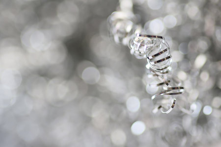 Lights on grey Silver Christmas background.  Christmas Background. Golden Holiday Abstract Glitter Defocused Background With Blinking Stars. Blurred Bokehの写真素材