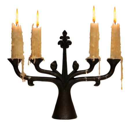 burning old candle vintage bronze Silver candlestick. Isolated On White Background.の写真素材
