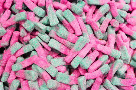Colorful texture using as background. A lot of sweets. Background 3d rendering illustration. Orange...