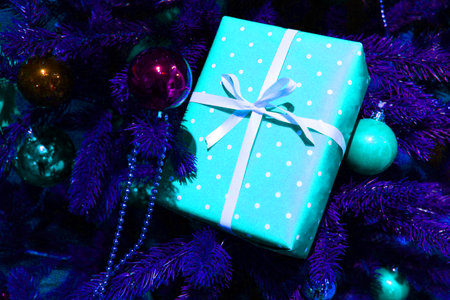 Christmas tree pine place for lettering christmas background New Years still life, Christmas tree toys. against the background of a decorated Christmas tree and boxes with giftsの写真素材