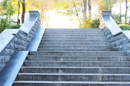 Gray granite steps in the city Closeup granite staircase, old staircase detail, abstract stone staircase background Antique gray stone staircase Cement ladder with, dirty ladder Abstract stairs in black and white, abstract steps, stairs in the city, granite stairs. High quality photoの写真素材
