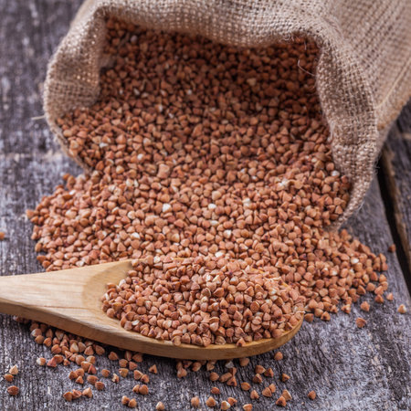 Buckwheat with a wooden spoonの写真素材