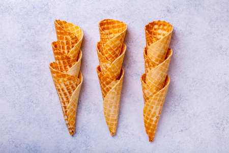 Waffle ice cream cone on a light background, horizontally