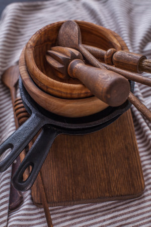 set of wooden utensils on a dark background, verticallyの写真素材
