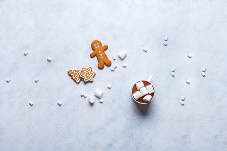 Christmas ginger cookies on a gray-blue background, horizontal, new Year, flat lay, copyspace, hands...