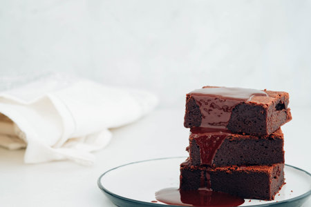 Chocolate brownie with chocolate syrup. American dessert.の写真素材