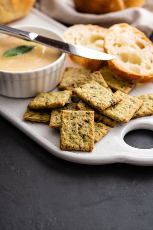 Chicken liver pate with bread on a white board over grey background.の写真素材