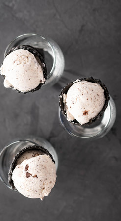 Speciality Italian stracciatella ice cream scoop with flakes of dark chocolate in a creamy vanilla...