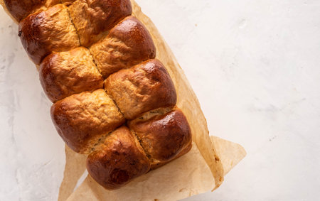 Fresh baked tasty sweet brioches, buns, loaves, bread isolated on white background.の写真素材