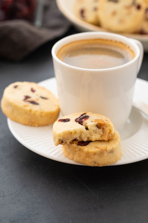 Closeup of cookies and a cup of coffee. Symbolic image. Concept for a tasty snack. Sweet dessert. Selective focus. Close up.の写真素材