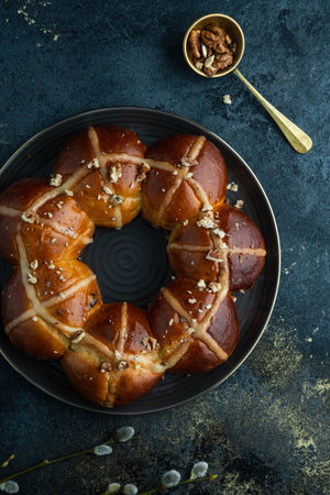 Easter cake and egg for the holiday. Homemade hot cross buns on Easter table.