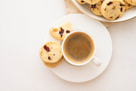 Coffee espresso in white cup with cookies. Copy space. Top view.の写真素材