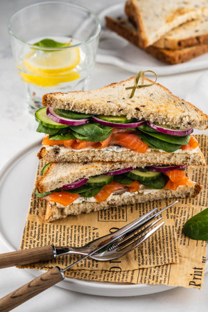 Sandwiches with cream cheese, ham and spinach.の写真素材