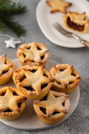 Delicious fruit mince tarts for Christmas dinner. Grey background.の写真素材