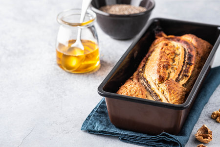 Cinnamon crunch banana bread on light concrete background. Selective focus, space for text.の写真素材
