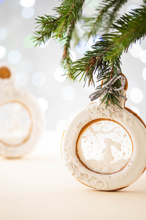 Gingerbread christmas ball on spruce branch. Copy space.の写真素材