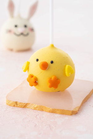 Delicious sweet cake pops on light background, closeup. Easter holiday.