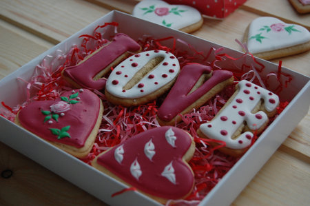ginger cookies in the shape of a heart and the inscription love in a boxの写真素材