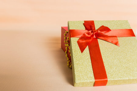gift box with Red Ribbon for gift,on a pink background