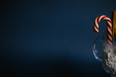 lollipops in a snowy glass on a blue background.の写真素材