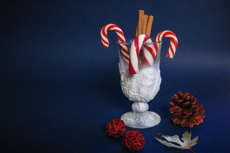 lollipops in a snowy glass on a blue background.coinsの写真素材