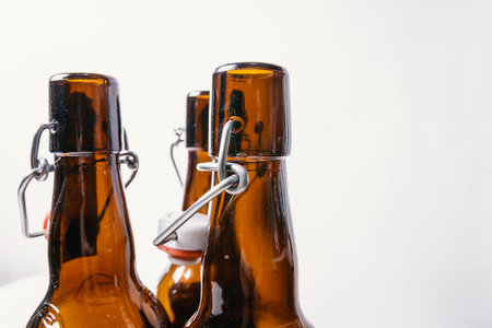 three empty Brown bottles with lids.