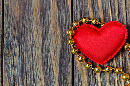 Red hearts on a wooden background.の写真素材