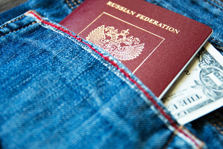 a Russian passport in your pocket with bills.の写真素材