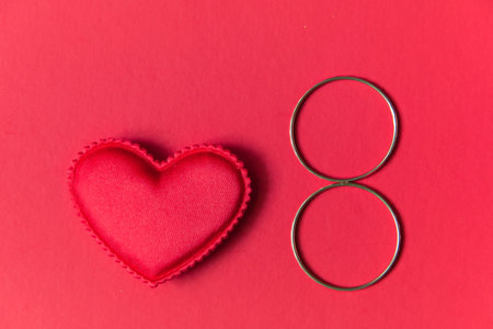 little red heart, and 8 symbol on a red background.の写真素材