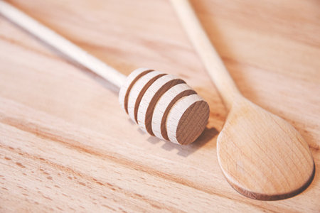 wooden wand for honey and wooden spoonの写真素材