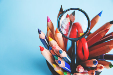 Different school or office supplies on a blue background. Education or business concept.の写真素材