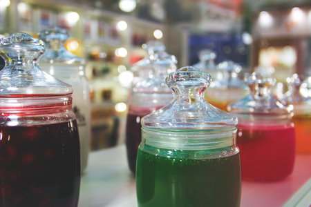 glass jars of jam and jelly for tasting on display.の写真素材