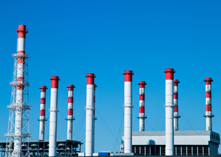 industrial enterprise against a blue sky.