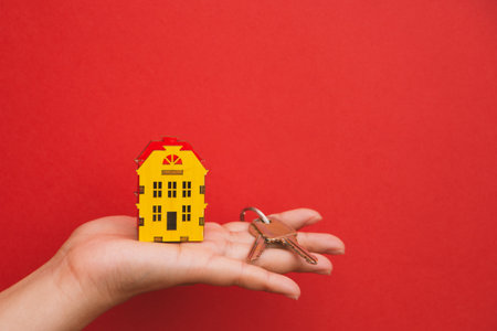 the symbol of the house and the keys in the palm of your hand.の写真素材