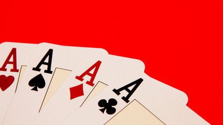 playing cards showing a four ACEs