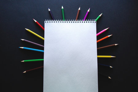 white blank landscape sheet and colored pencils on dark flatlay background.の写真素材
