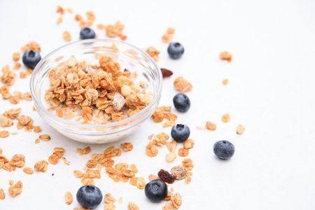 Crunchy muesli and blueberry Breakfast cereals isolated on white background, selective focus, top view.の写真素材