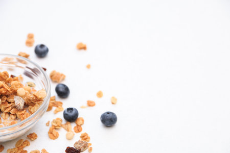 Crunchy muesli and blueberry Breakfast cereals isolated on white background, selective focus, top view.の写真素材