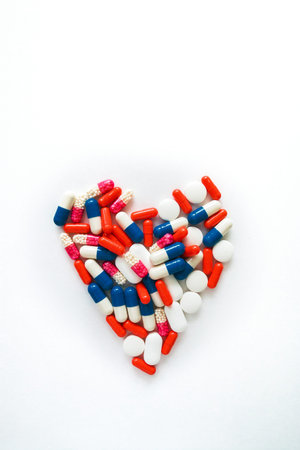 Multicolored capsules isolated on white background, copyspace for text, selective focus, top view....